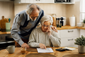 Retired couple reviewing paperwork at home as part of retirement cashflow planning