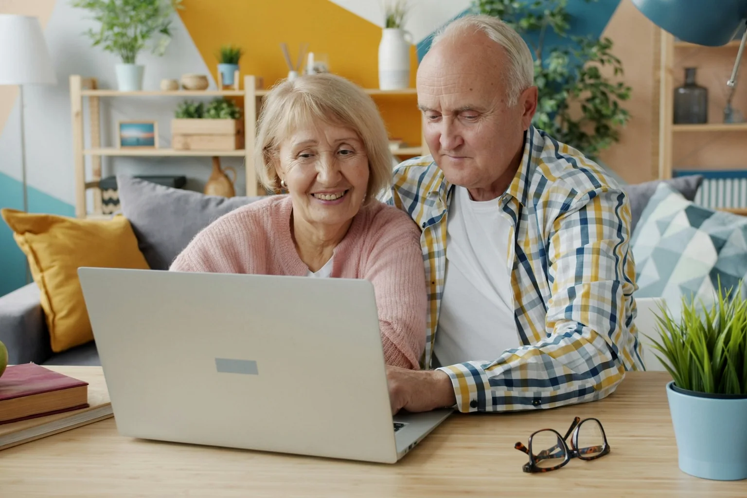 Retired couple reviewing superannuation changes and retirement planning options online